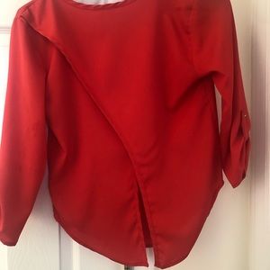 Bright, V-flowy open back roll sleeve blouse